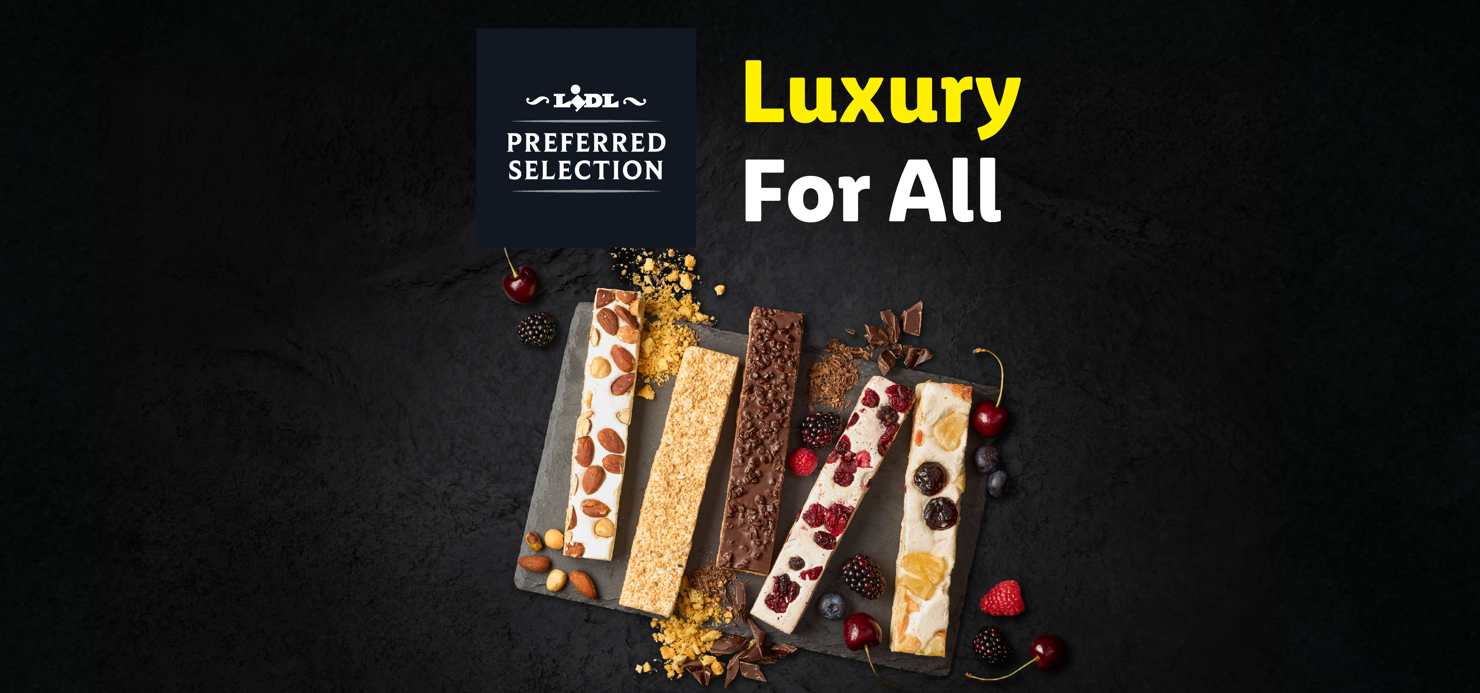Nougat bars with nuts, fruits, and chocolate on a dark background, with text 'Luxury For All'.